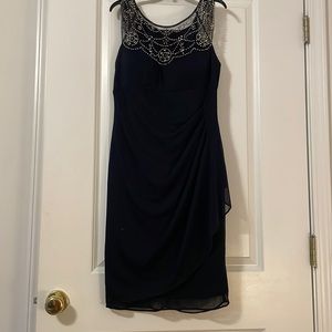 Black evening dress with be-dazzled collar